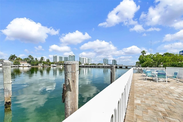 dock area featuring a view of city and a water view