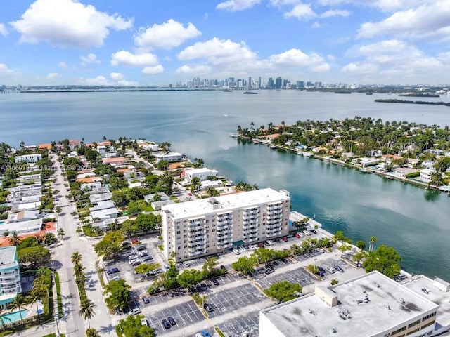 bird's eye view featuring a view of city and a water view