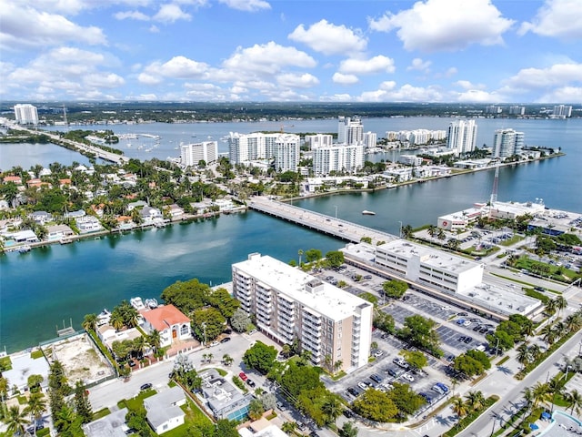 aerial view featuring a city view and a water view