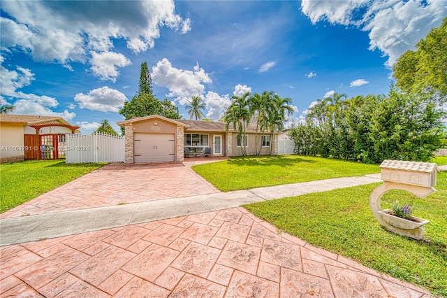 single story home with a garage and a front lawn