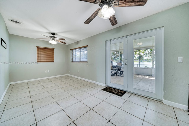 entryway featuring light tile patterned flooring and ceiling fan