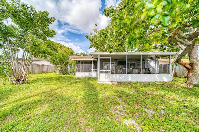 view of yard featuring a sunroom