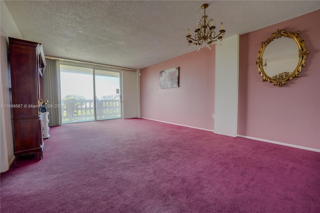 carpeted empty room with a textured ceiling and an inviting chandelier