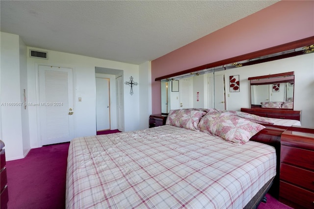 carpeted bedroom featuring a textured ceiling