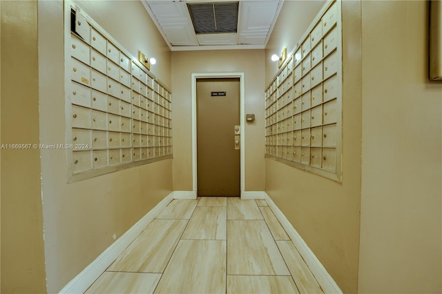 hallway with mail boxes and elevator