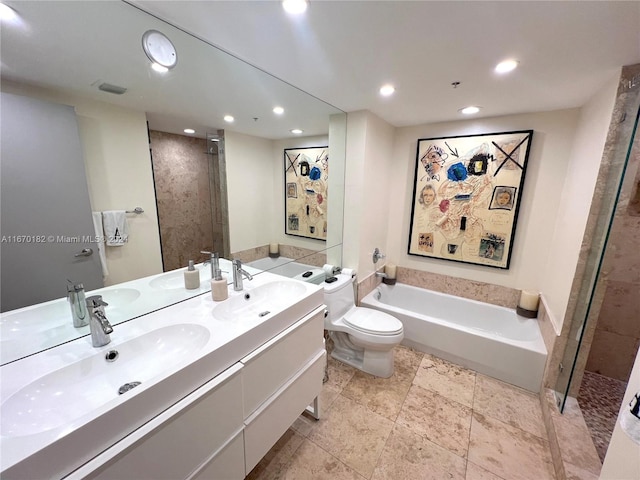 full bathroom featuring independent shower and bath, vanity, and toilet