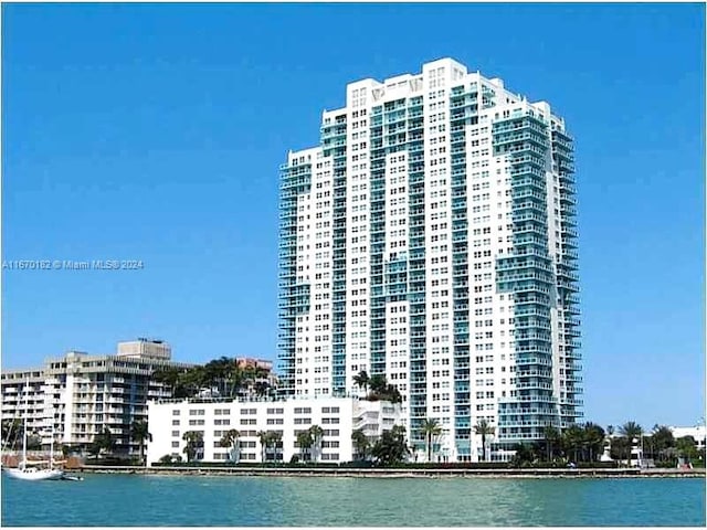 view of building exterior with a water view