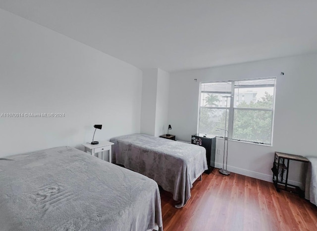 bedroom featuring hardwood / wood-style floors