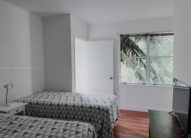 bedroom featuring hardwood / wood-style flooring