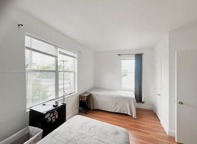 bedroom with light hardwood / wood-style floors