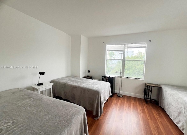 bedroom featuring wood-type flooring