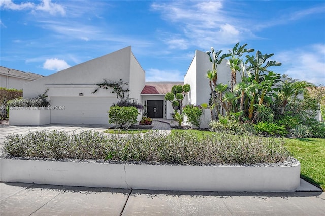 view of front of property with a garage