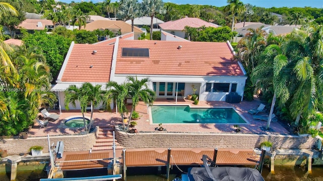 exterior space featuring a water view and a patio area