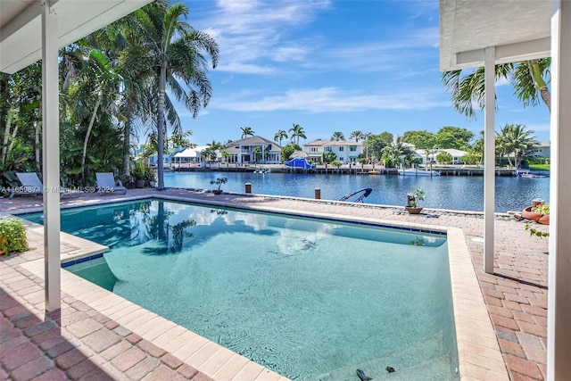 view of swimming pool with a water view