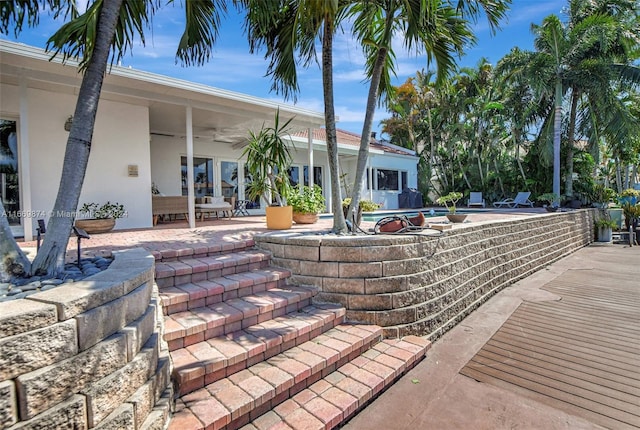 view of patio / terrace featuring ceiling fan