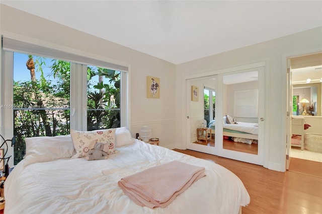 bedroom featuring a closet and light hardwood / wood-style floors