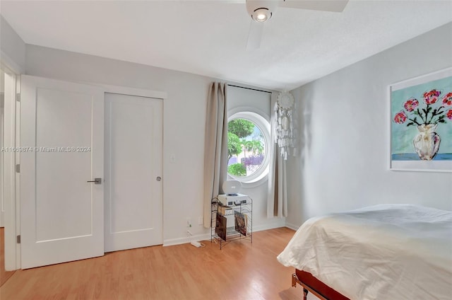 bedroom featuring ceiling fan and light wood-type flooring