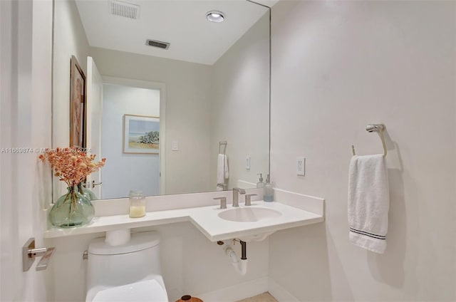 bathroom with sink and toilet