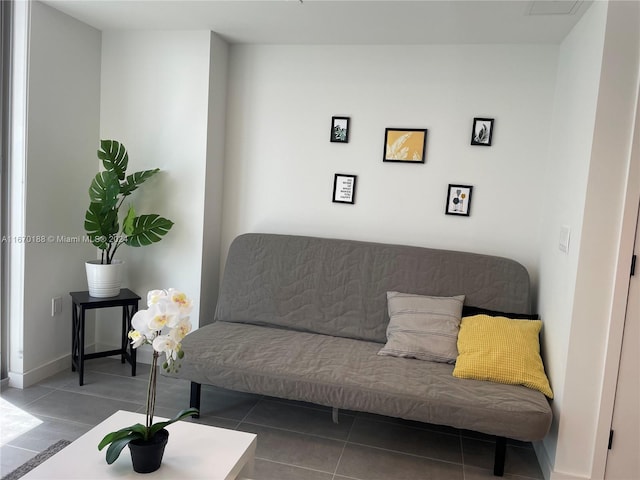 living room with dark tile patterned floors