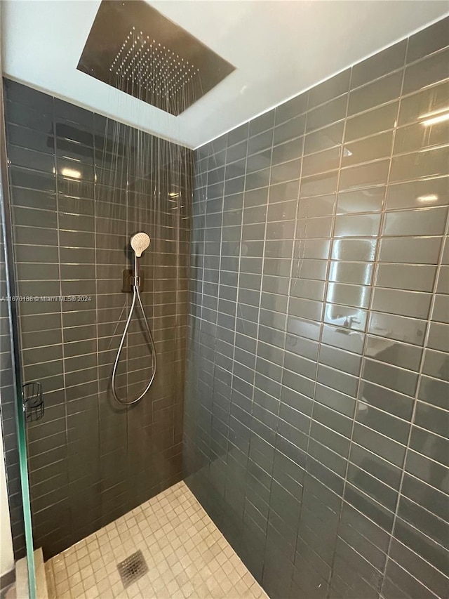 bathroom with a tile shower