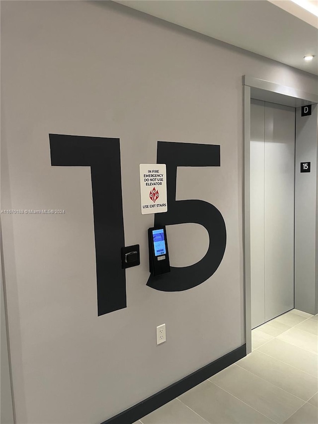 interior details with elevator and tile patterned floors