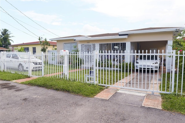 single story home with a front yard and a carport