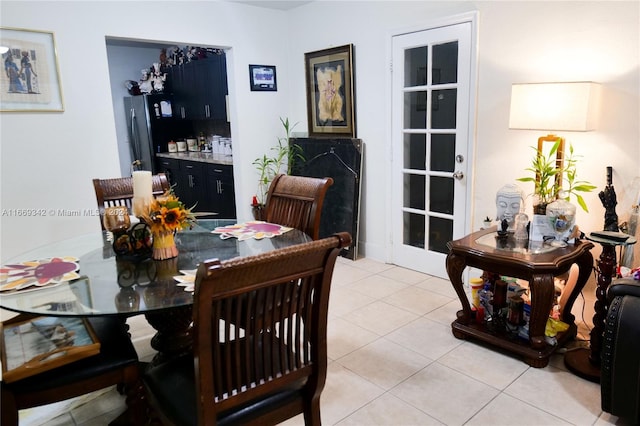 dining space with light tile patterned floors