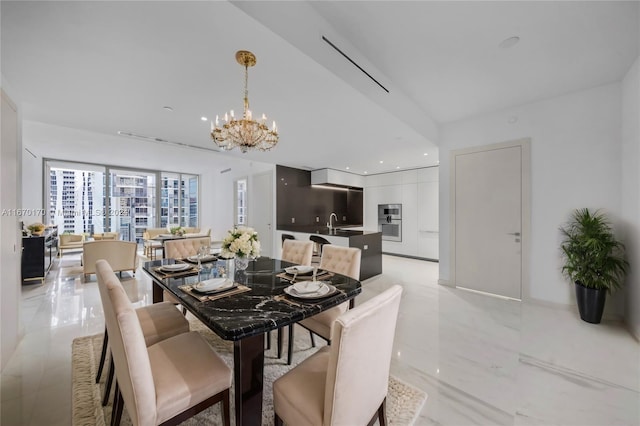 dining room featuring an inviting chandelier and sink