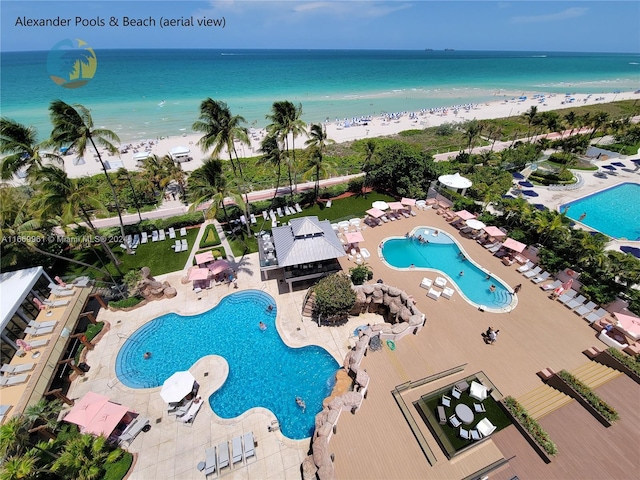 aerial view with a view of the beach and a water view