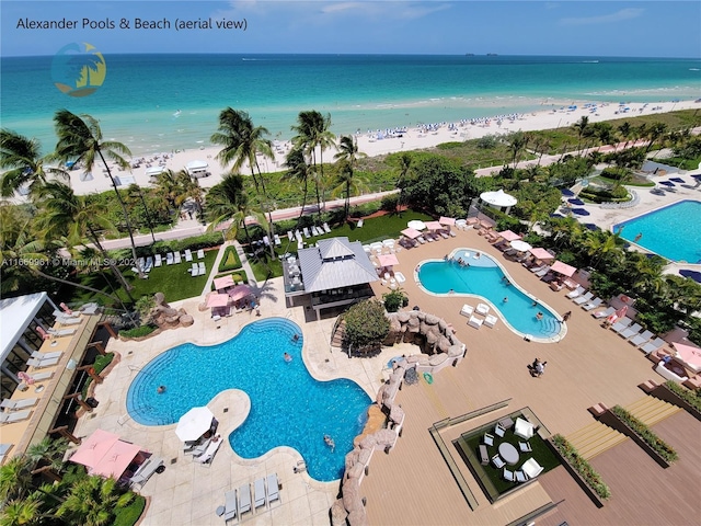 bird's eye view with a view of the beach and a water view