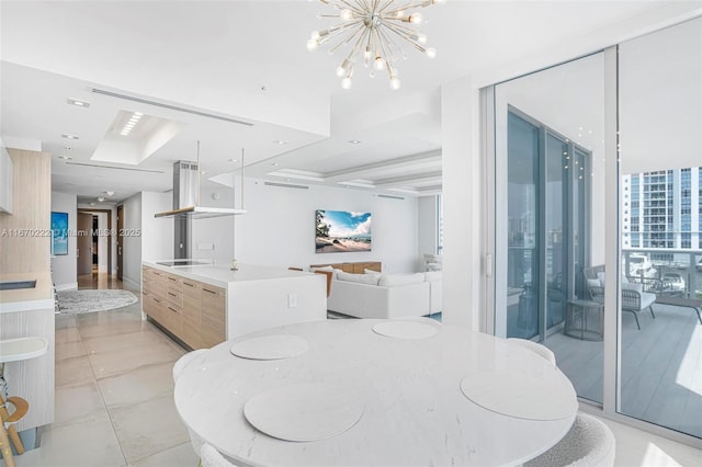 dining room featuring floor to ceiling windows and a notable chandelier