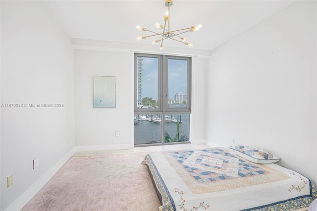 bedroom with a notable chandelier