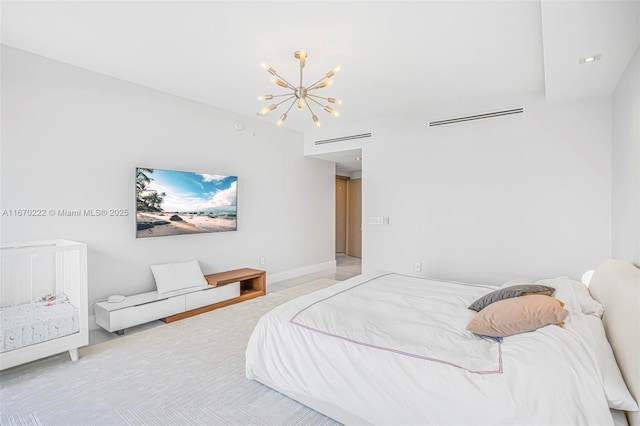 bedroom featuring an inviting chandelier