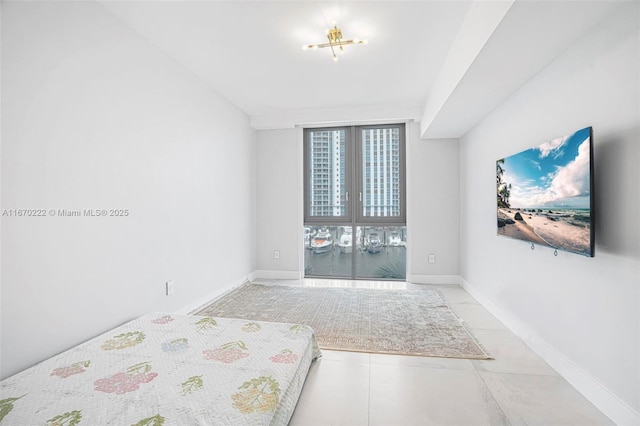 unfurnished bedroom with floor to ceiling windows and light tile patterned floors