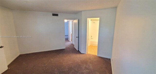 215 Lake Pointe Dr Unit 210, Oakland Park, FL 33309 - unfurnished room featuring carpet floors, baseboards, and visible vents