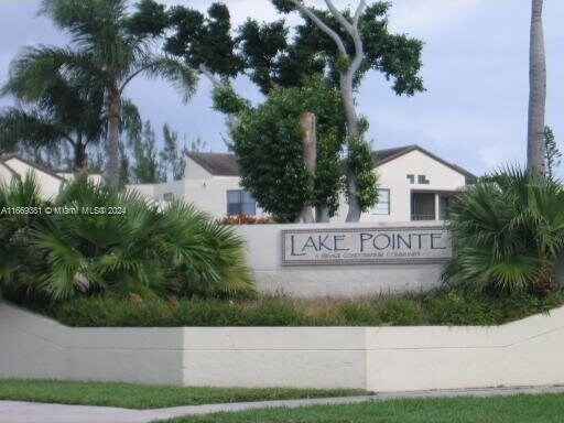 215 Lake Pointe Dr Unit 210, Oakland Park, FL 33309 - view of community / neighborhood sign