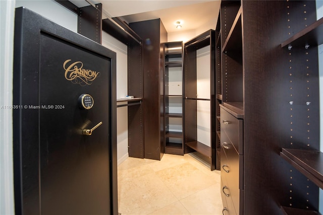 spacious closet with light tile patterned flooring