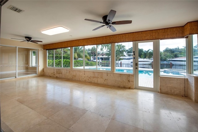 unfurnished room featuring ceiling fan