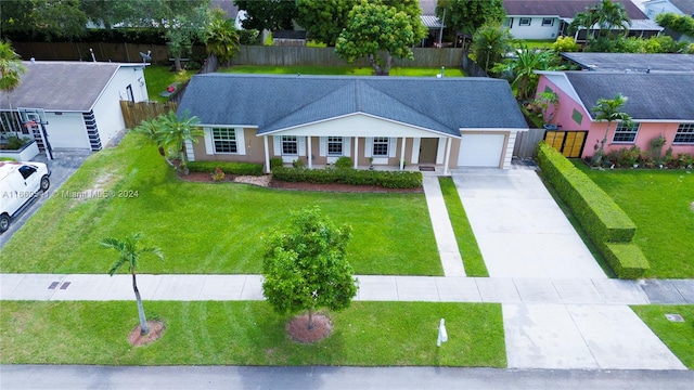 view of front of property featuring a garage and a front yard