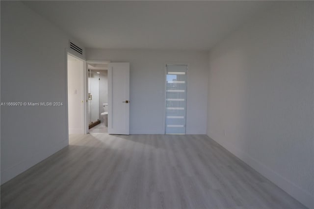 unfurnished room with light hardwood / wood-style floors