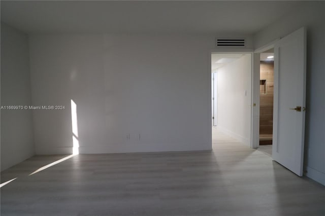 spare room featuring hardwood / wood-style floors