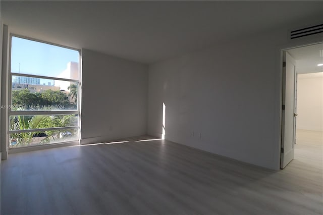 spare room featuring hardwood / wood-style floors