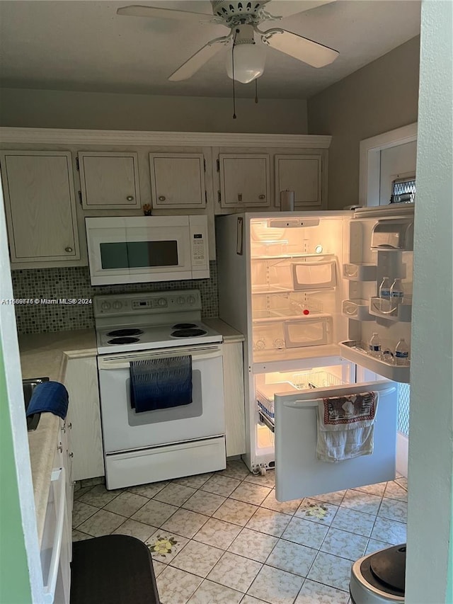 kitchen featuring ceiling fan, backsplash, light tile patterned floors, and white appliances