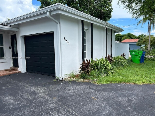 view of side of home with a garage