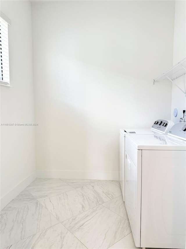 laundry room with independent washer and dryer