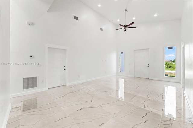 interior space featuring high vaulted ceiling and ceiling fan