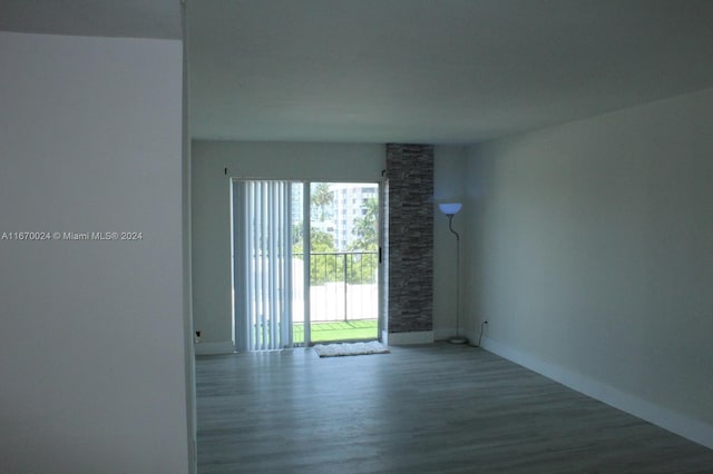 empty room with hardwood / wood-style flooring