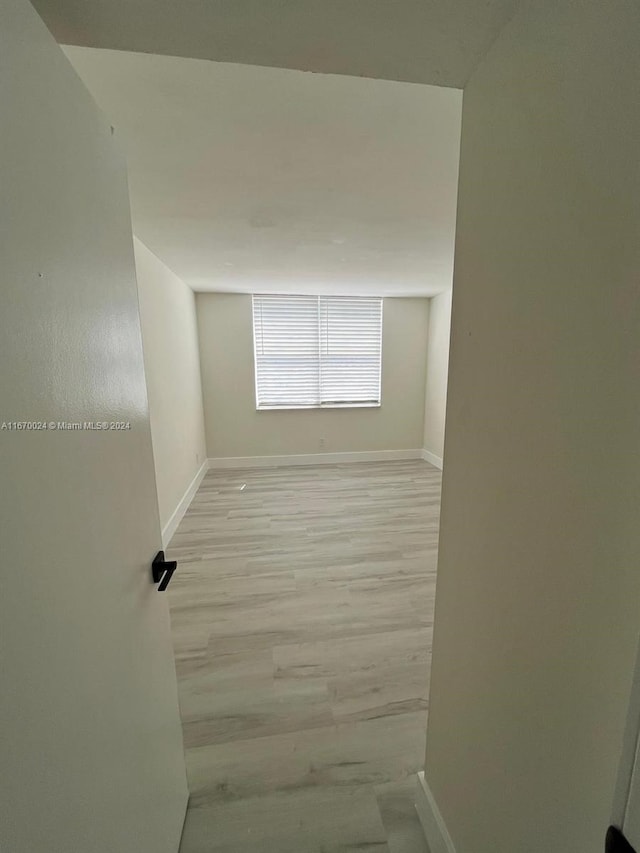 unfurnished room featuring light hardwood / wood-style floors