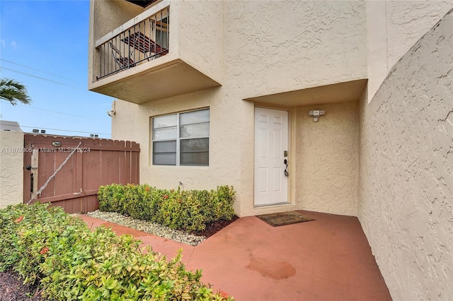 property entrance with a balcony