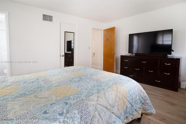 bedroom featuring light wood-type flooring